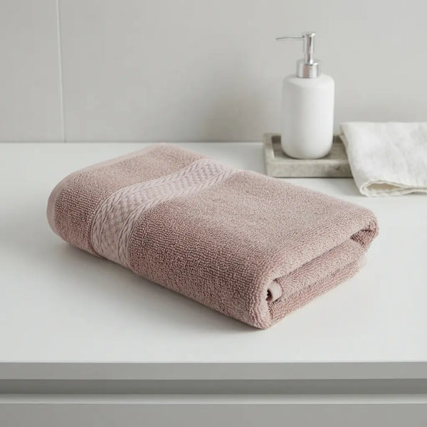 Bamboo Bath Towels rolled neatly on a table, showcasing spa-like softness and elegant design for self-care.