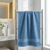 Bamboo Bath Towels hanging on a towel rack in a modern bathroom for spa-like luxury and comfort.