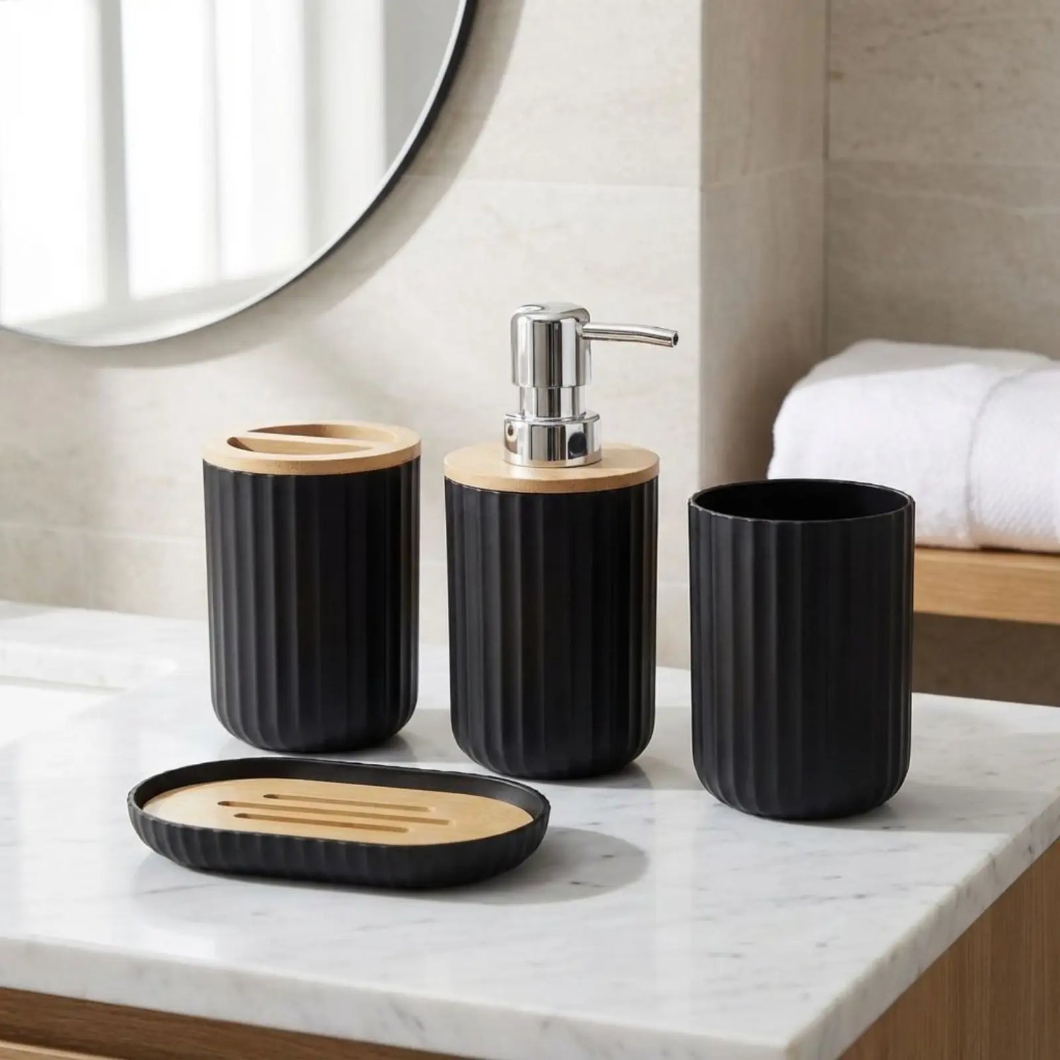 Bathroom set with black and bamboo-toned containers on a marble countertop.
