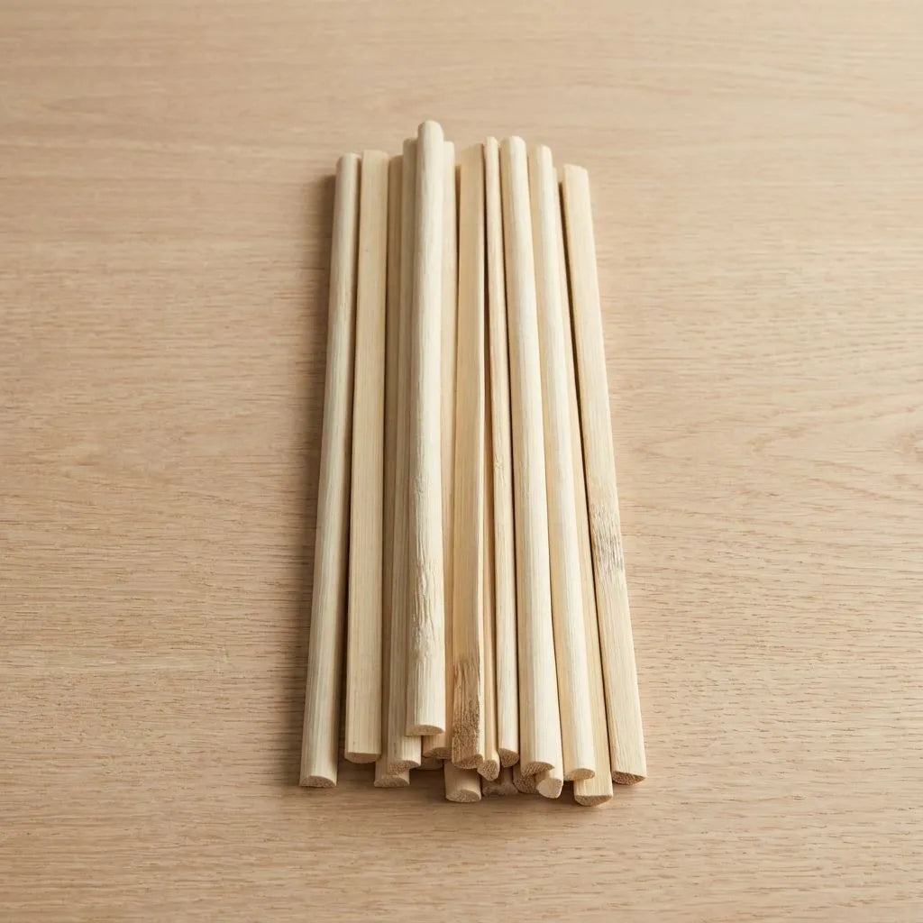 Bulk of D-shape bamboo stick on a wooden surface