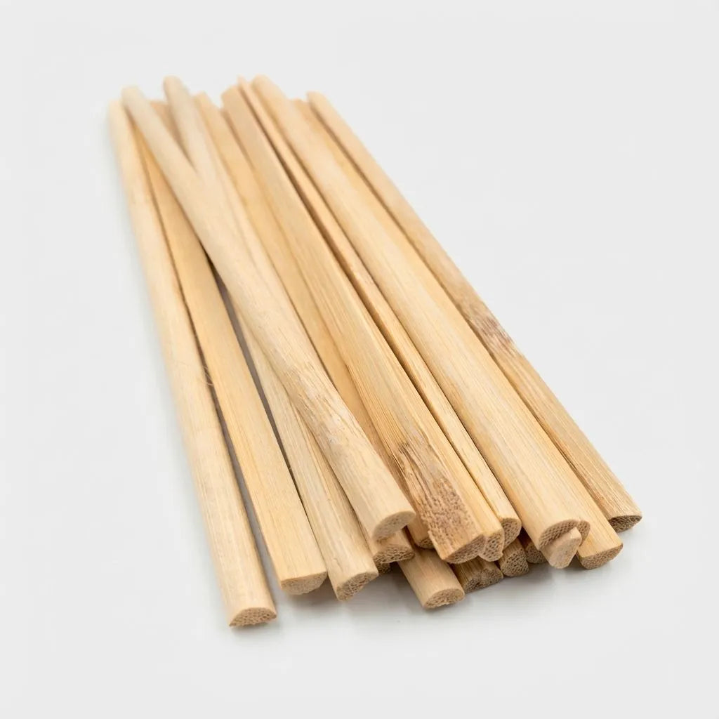 bulk of D-shape bamboo sticks on a light gray background