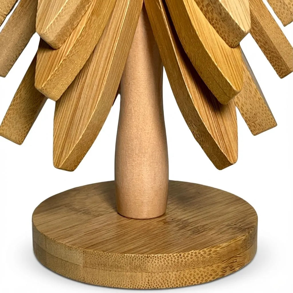 Bamboo trivet resembling a tree with a round base on a white background
