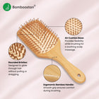 Bamboo hairbrush with features highlighted on a light pink background.