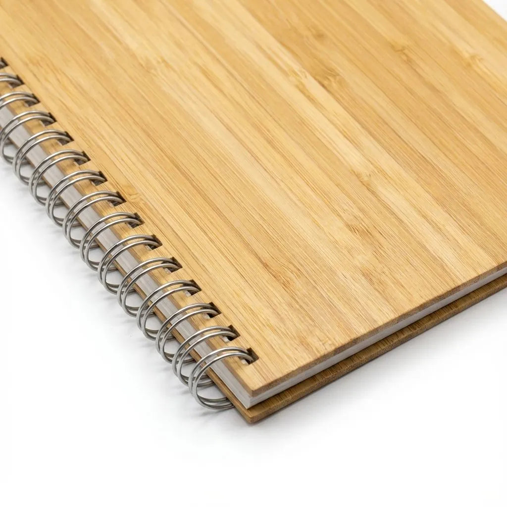 Bamboo notebook with metal spiral binding on a white background