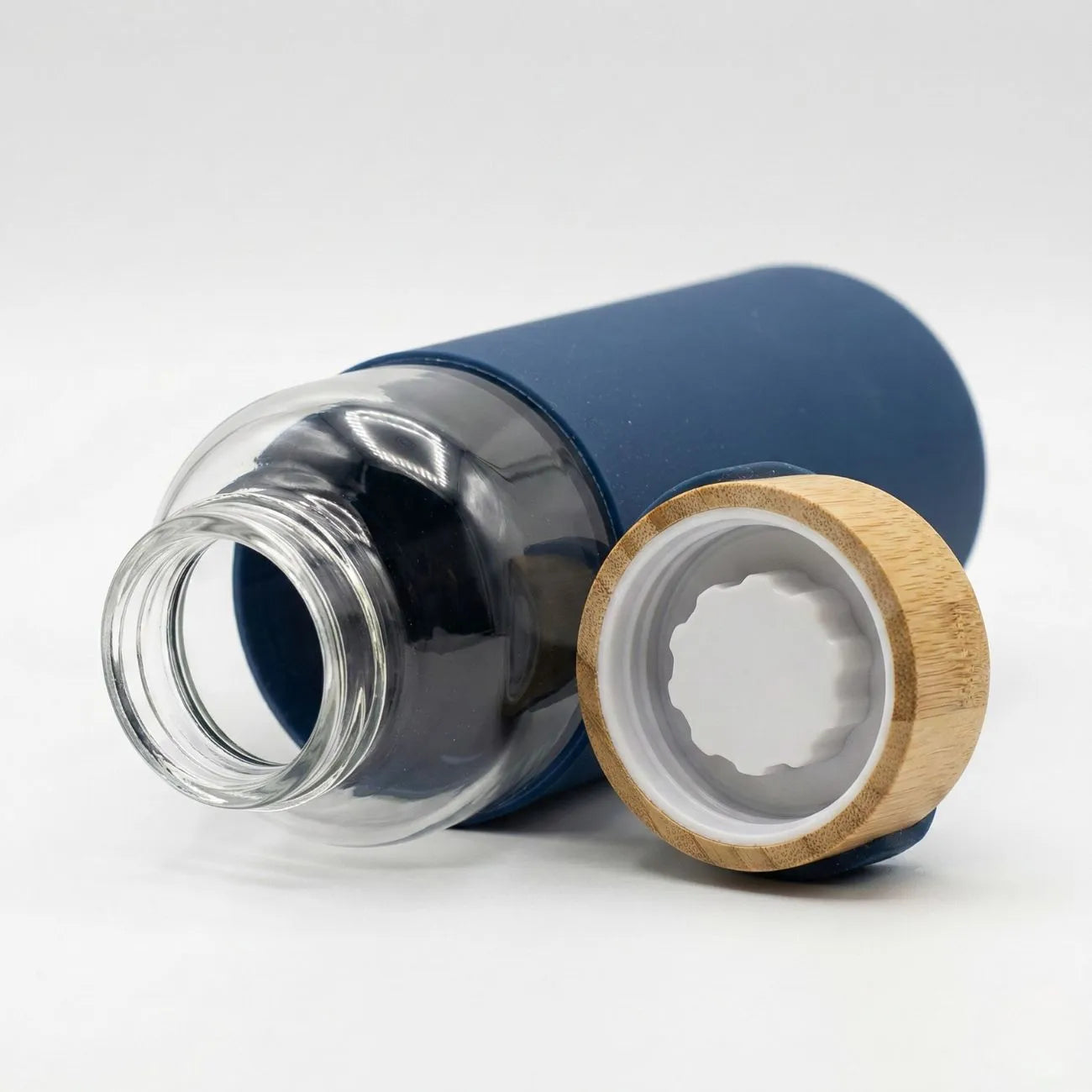 Bamboo Water Bottle with a clear glass body and natural bamboo cap, showcasing the easy grip design.