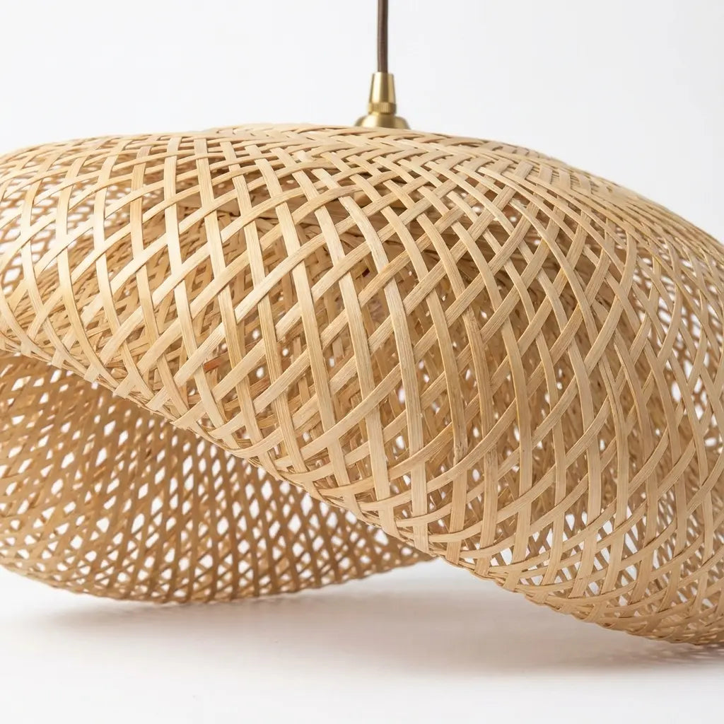 Woven bamboo pendant light on a white background