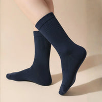 Bamboo Crew Socks in navy blue, showcasing a ribbed texture and longer cuff for comfort and fit.