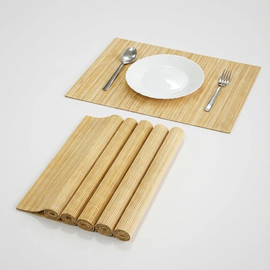 Set of bamboo placemats with a plate, spoon, and fork on a white background
