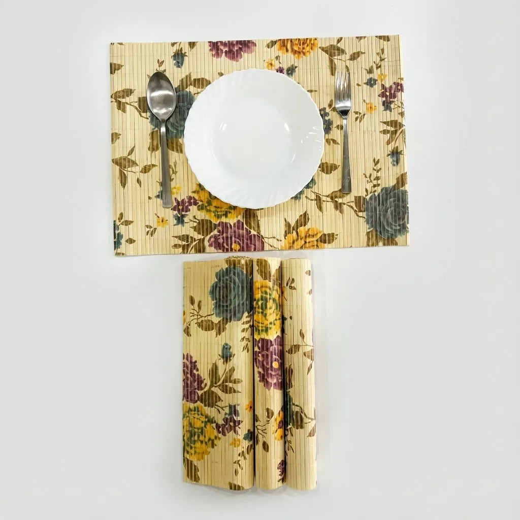 Floral-patterned bamboo placemat with a plate, cutlery, and napkins on a white background