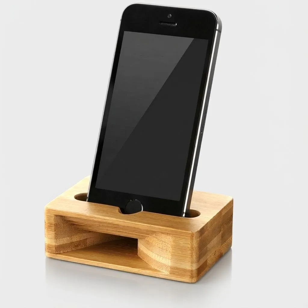 Smartphone on a bamboo amplifier stand against a light gray background