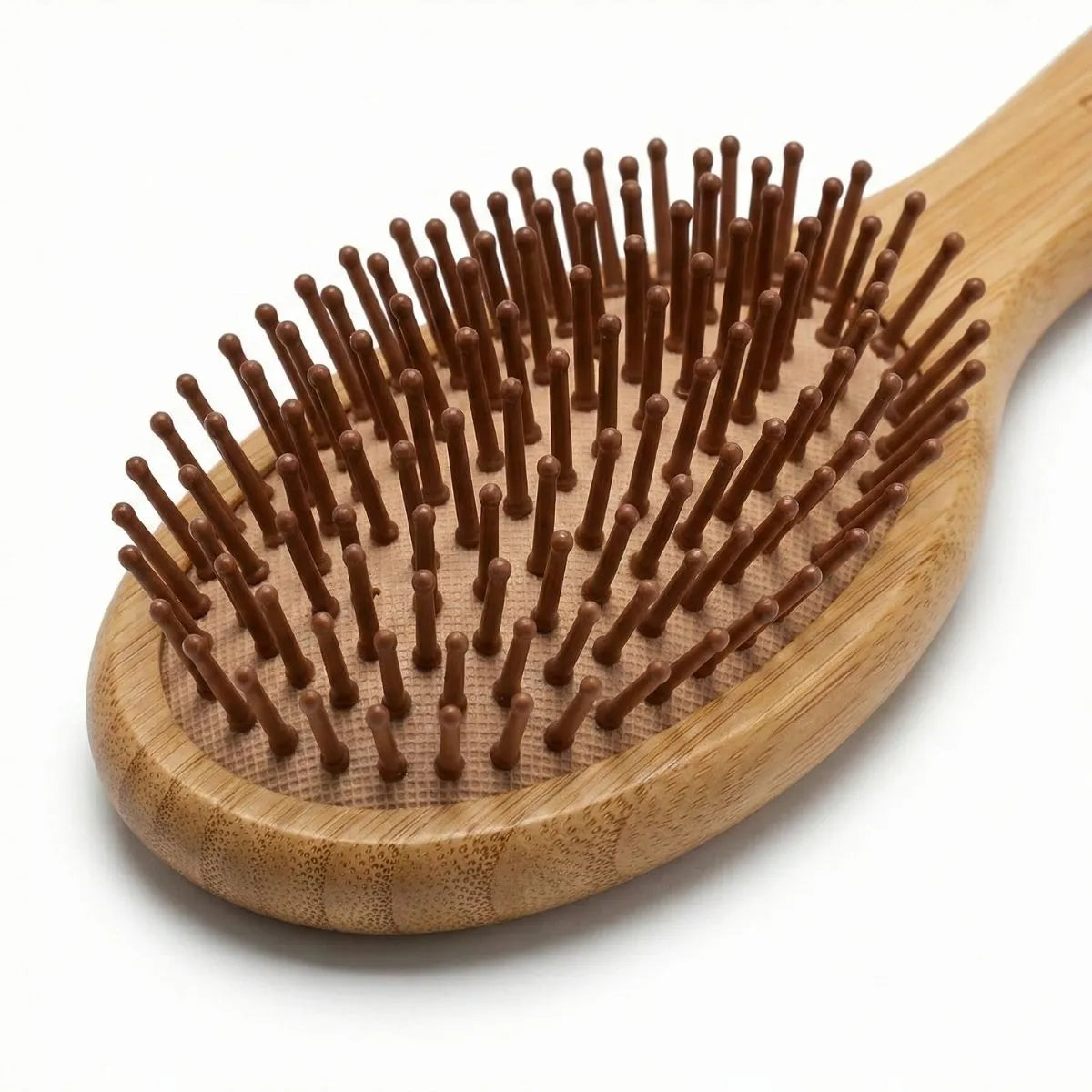 Bamboo Oval Hairbrush featuring smooth, rounded bristles for gentle detangling and soothing scalp massage.