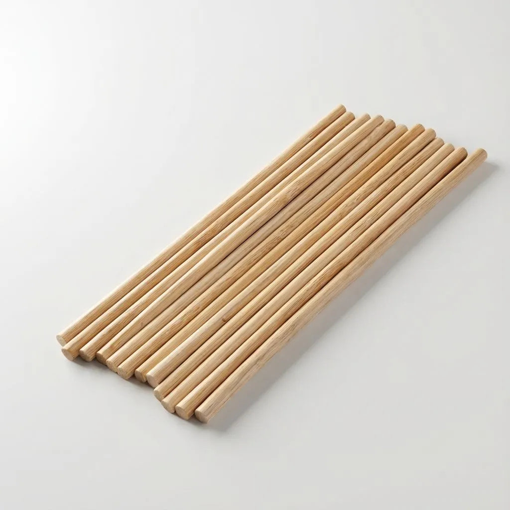 Set of bamboo sticks on a light gray background