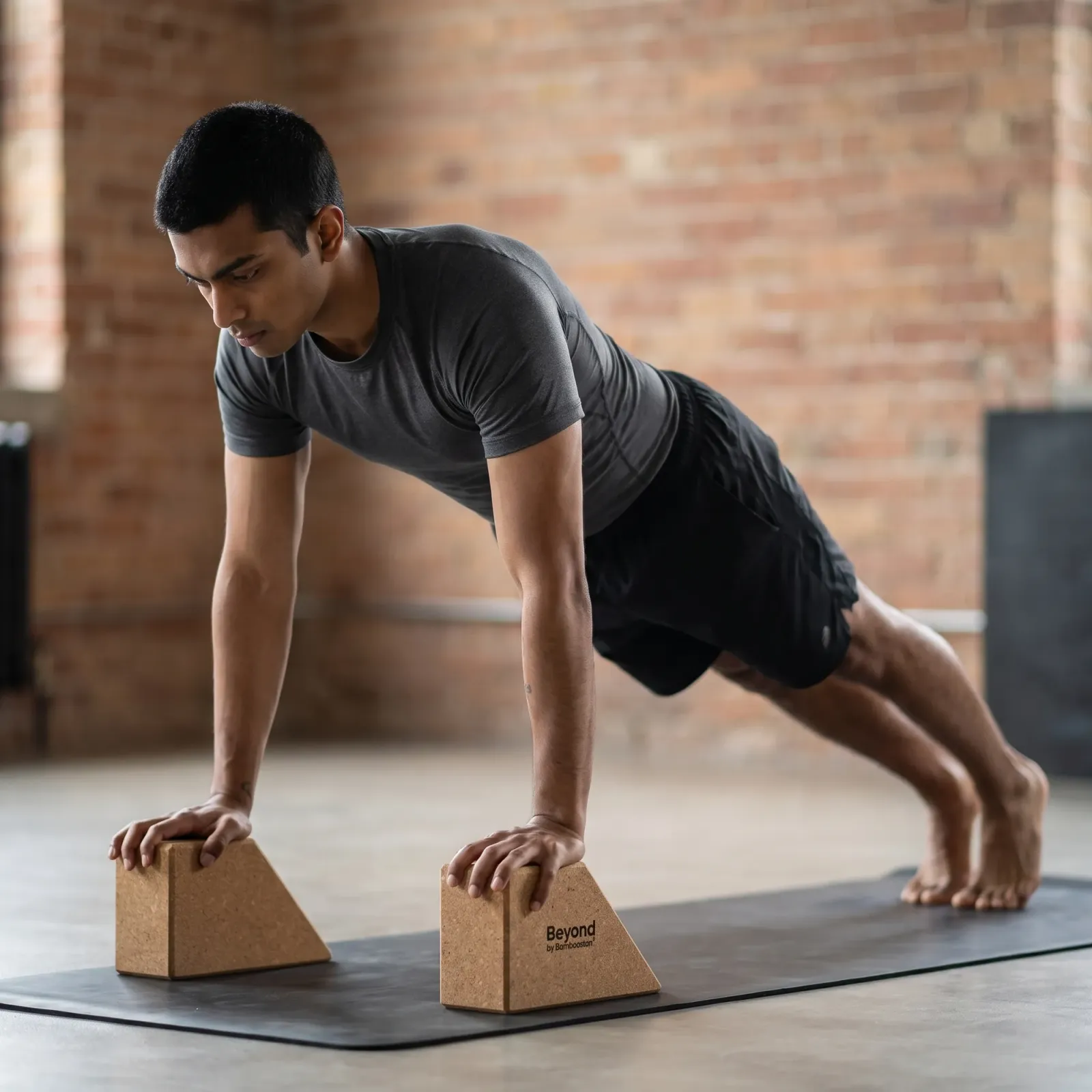 A raised rest for the hands in plank